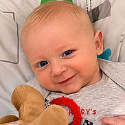 Ryder joined the competition — help win amazing prizes! baby, blue_eyes, smile, soft_toy, blanket, infant, cute, face, hand, clothing, lying_down, comfort, child, portrait, indoors, happy, closeup, skin, head, expression