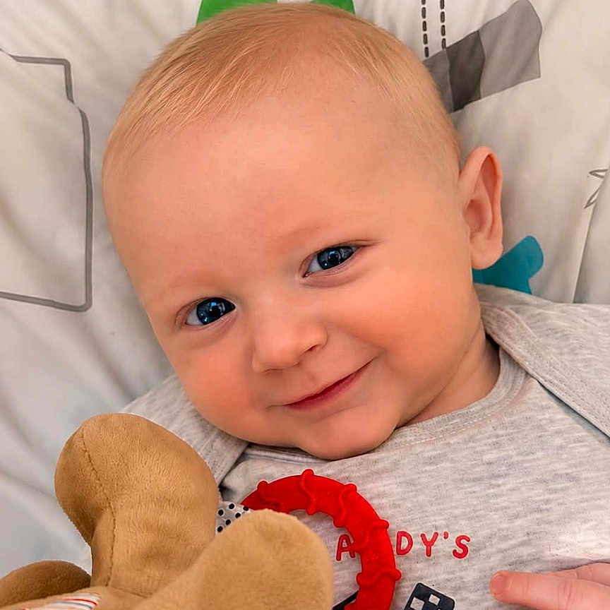 Ryder joined the competition — help win amazing prizes! baby, blue_eyes, smile, soft_toy, blanket, infant, cute, face, hand, clothing, lying_down, comfort, child, portrait, indoors, happy, closeup, skin, head, expression