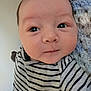 Noah is registered to the contest to win money with this photo: baby, infant, face, striped_shirt, closeup, portrait, child, newborn, cute, expression, soft, blanket, indoors, person, skin, head, eyebrows, eyes, clothing, young