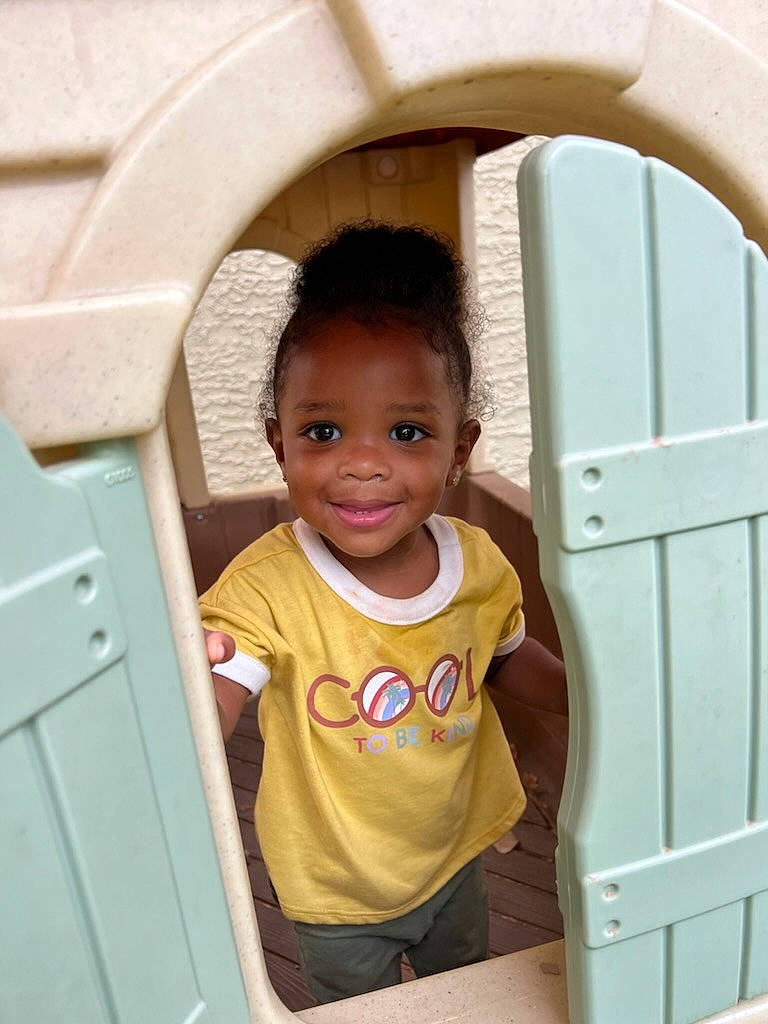 Salem is registered to the contest to win money with this photo: baby_toddler_clothing, cabinetry, chair, child, chin, door, drawer, eye, face, facial_expression, fun, happy, joy, nose, person, room, skin, smile, standing, toddler