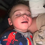 Julian joined the competition — help win amazing prizes! child, toddler, sleeping, face, mouth_open, closed_eyes, pajamas, onesie, space_theme, rocket, stars, bed, blanket, comfort, young_child, indoor, portrait, relaxation, cute, baby
