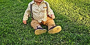 Sahib is registered to the contest to win money with this photo: boy, child, clothing, face, footwear, grass, head, lawn, male, nature, outdoors, pants, park, person, photography, plant, portrait, shoe, sitting, vegetation
