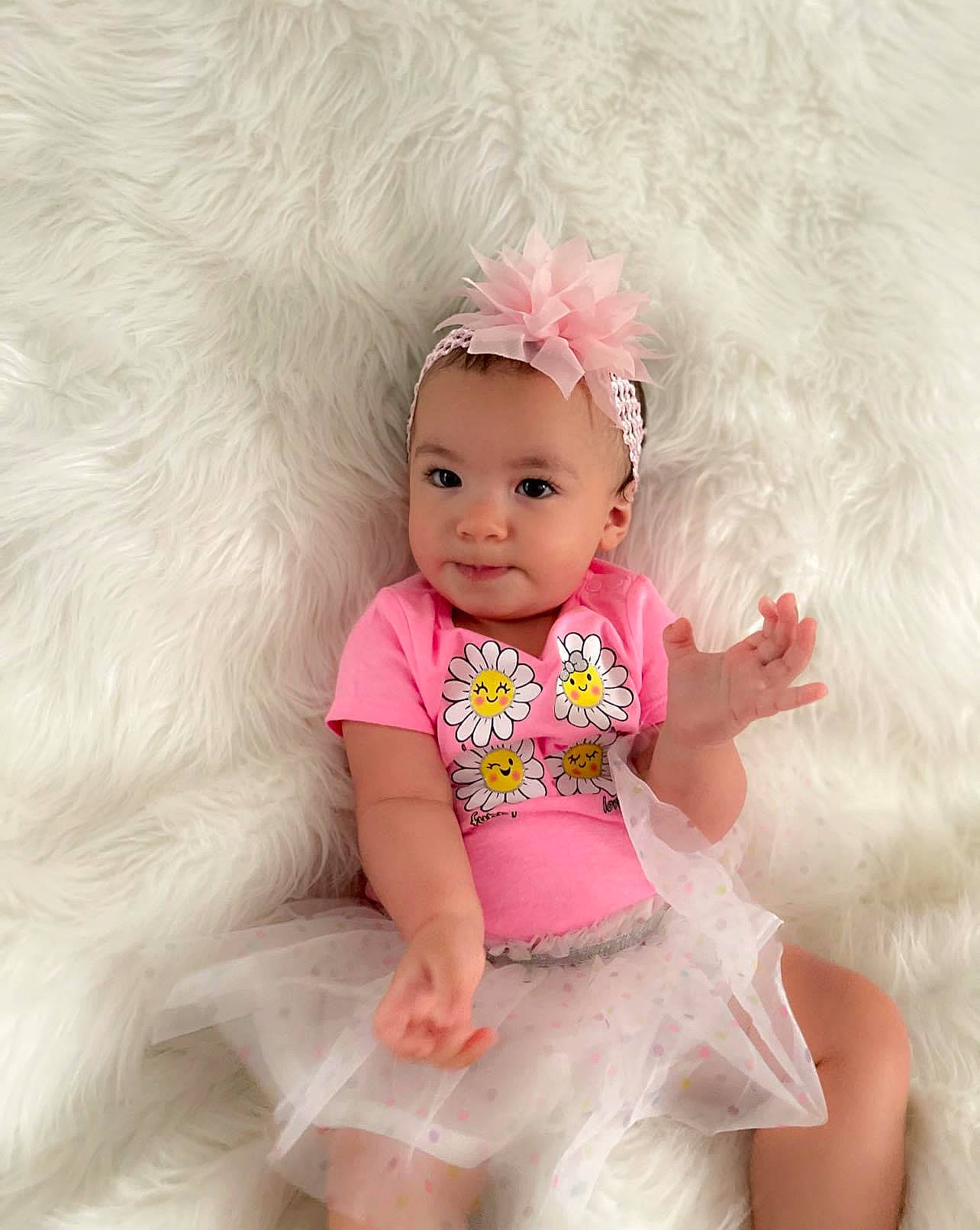 Reminisce joined the competition — help win amazing prizes! arm, baby, baby_toddler_clothing, child, clothing, dress, face, facial_expression, hair_accessory, happy, head, headband, headgear, headpiece, magenta, person, pink, skin, sleeve, textile