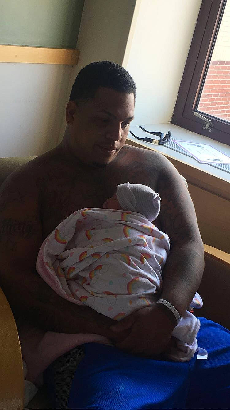 Marco is registered to the contest to win money with this photo: abdomen, arm, barechested, chest, elbow, joint, knee, leg, muscle, neck, person, room, shoulder, sitting, t_shirt, trunk, under_exposed