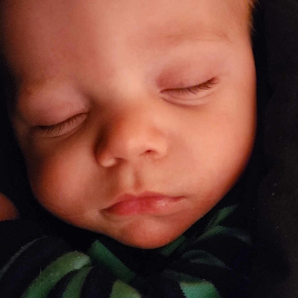Nicholas is registered to the contest to win money with this photo: baby, cheek, comfort, ear, eye, eyebrow, eyelash, finger, flash_photography, forehead, iris, jaw, lip, mouth, neck, nose, skin, sleeve, smile, toddler