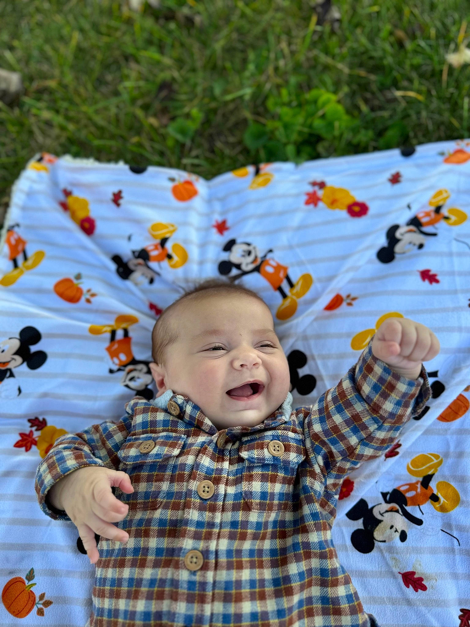 Weston is registered to the contest to win money with this photo: baby, baby_toddler_clothing, child, fun, grass, happy, leaf, leisure, linens, pattern, people_in_nature, person, plaid, product, recreation, sleeve, smile, tartan, textile, toddler