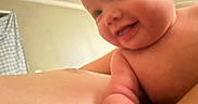 Everleigh is registered to the contest to win money with this photo: arm, baby, background, cheeks, child, closeup, curtain, cute, expression, face, happy, human, indoor, infant, person, portrait, room, skin, smiling, warm_light