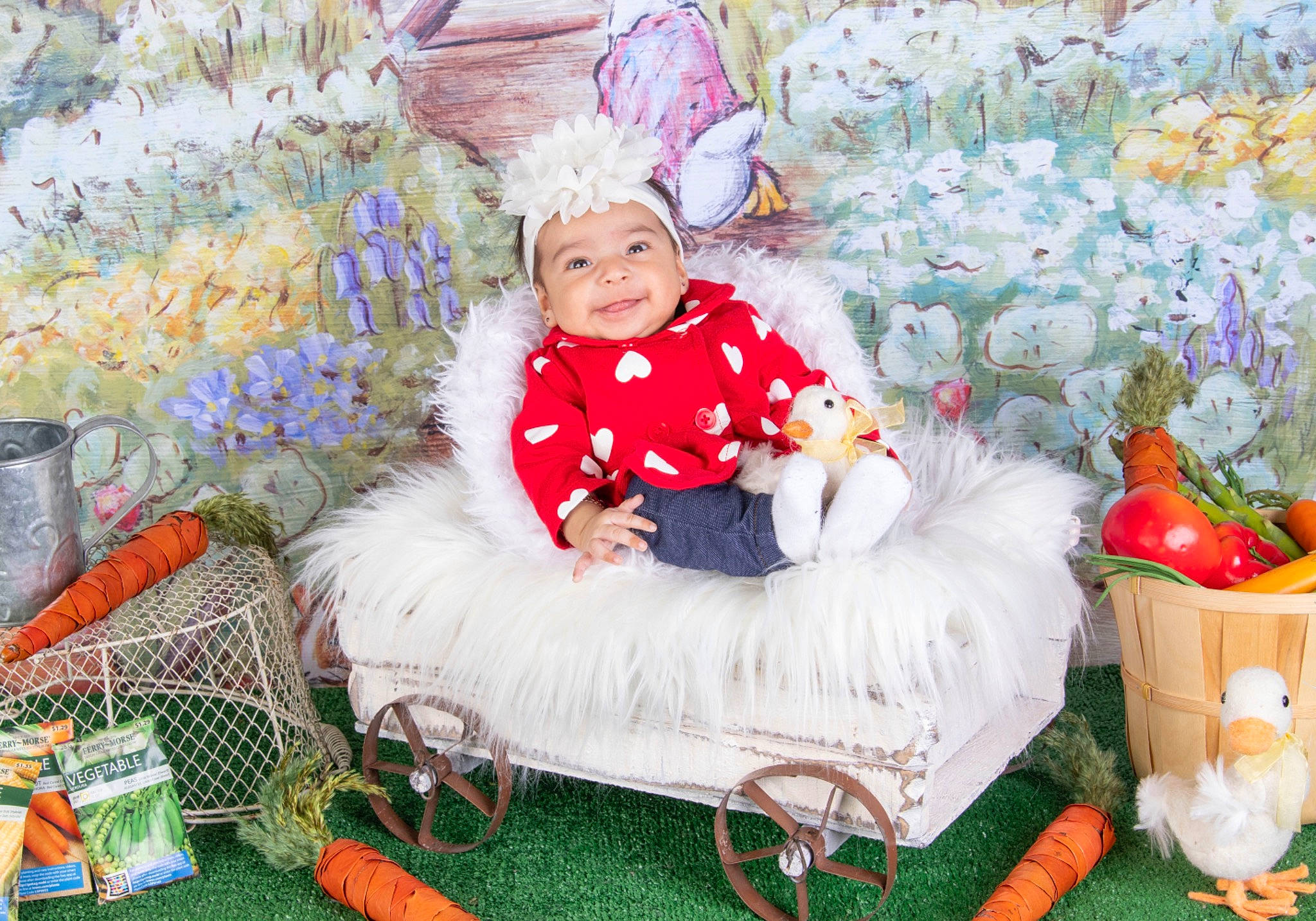 Selena is registered to the contest to win money with this photo: baby_toddler_clothing, child, christmas_eve, event, fun, grass, green, happy, hat, headwear, holiday, joy, lap, leisure, magenta, person, pink, sitting, smile, textile