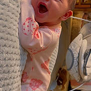 Anya joined the competition — help win amazing prizes! baby, infant, smiling, pink_clothing, ladybug_pattern, blanket, indoor, soft_texture, happy, cute, child, sleepwear, face, newborn, cozy, nursery, lying_down, person, expression, warm_lighting