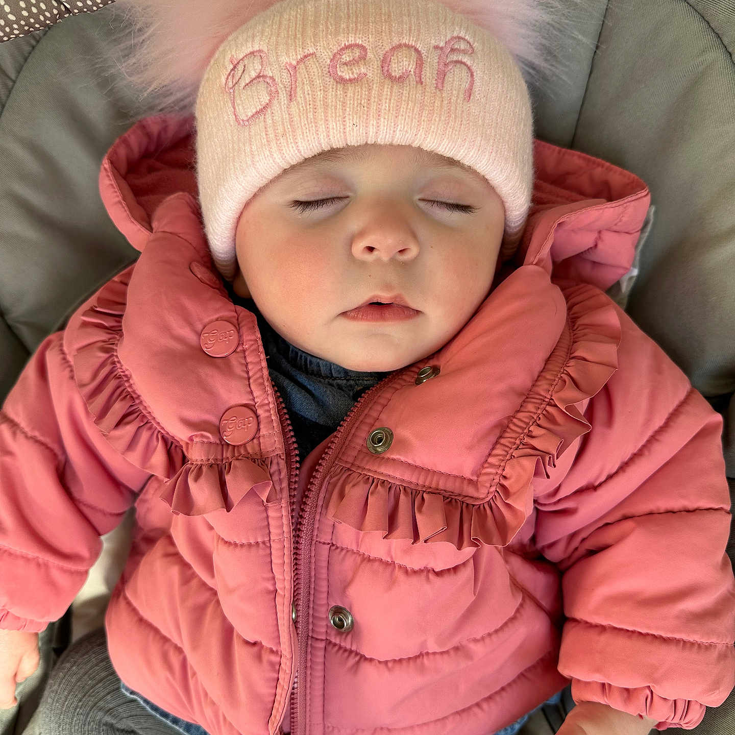 Breah is registered to the contest to win money with this photo: baby, beanie, bonnet, cap, clothing, coat, face, glove, hat, head, hood, hoodie, jacket, knitwear, pants, person, photography, portrait, sweater, sweatshirt