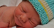 Zane joined the competition — help win amazing prizes! newborn, baby, sleeping, hat, knitted_hat, infant, closeup, face, peaceful, resting, blanket, skin, child, cute, soft, hospital_bracelet, portrait, young, cozy, indoors