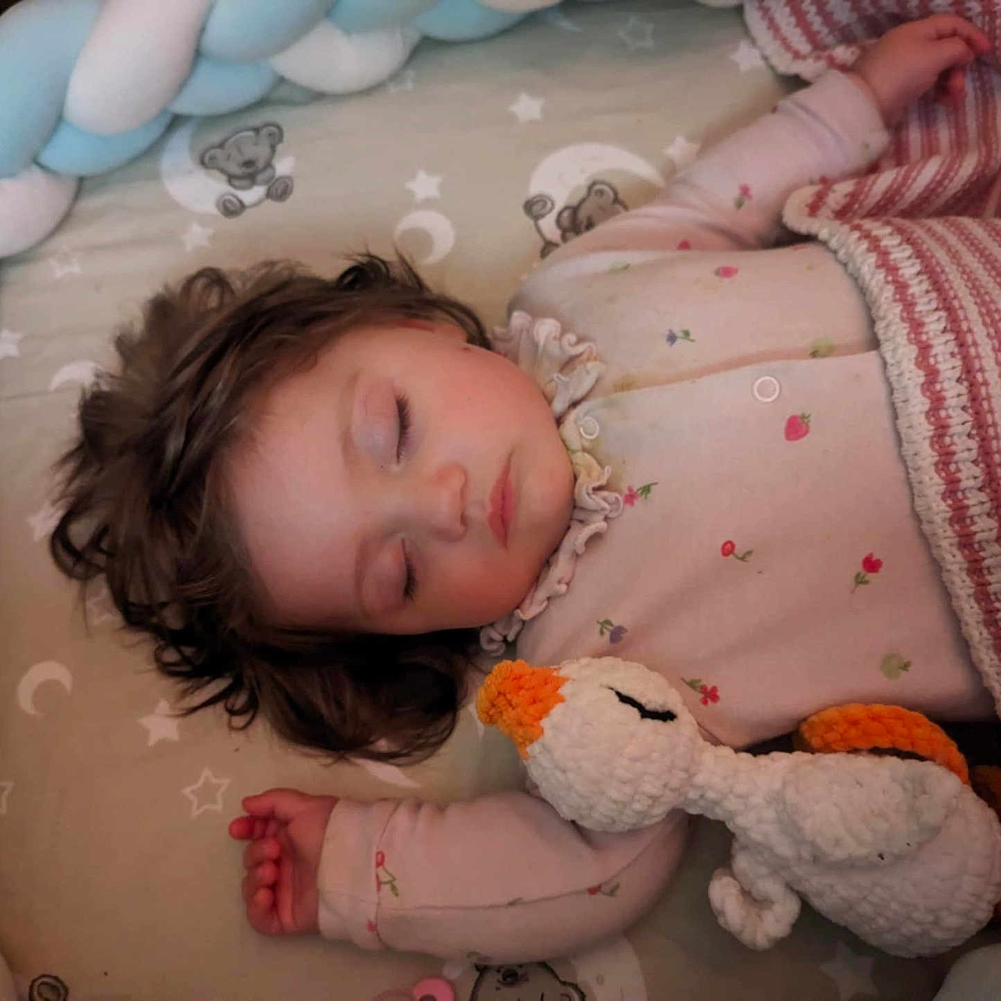 Celia is registered to the contest to win money with this photo: bed, bedroom, blanket, braided_bumper, child, cozy, crib, cute, duck, face, hair, hand, infant, pajamas, plush_toy, sleep, sleeping, soft, stuffed_animal, toddler