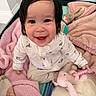 baby, child, smiling, happy, toy, plush_elephant, blanket, pink, white_clothing, indoor, cute, infant, sitting, face, hand, soft_toys, warm, comfort, playful, portrait