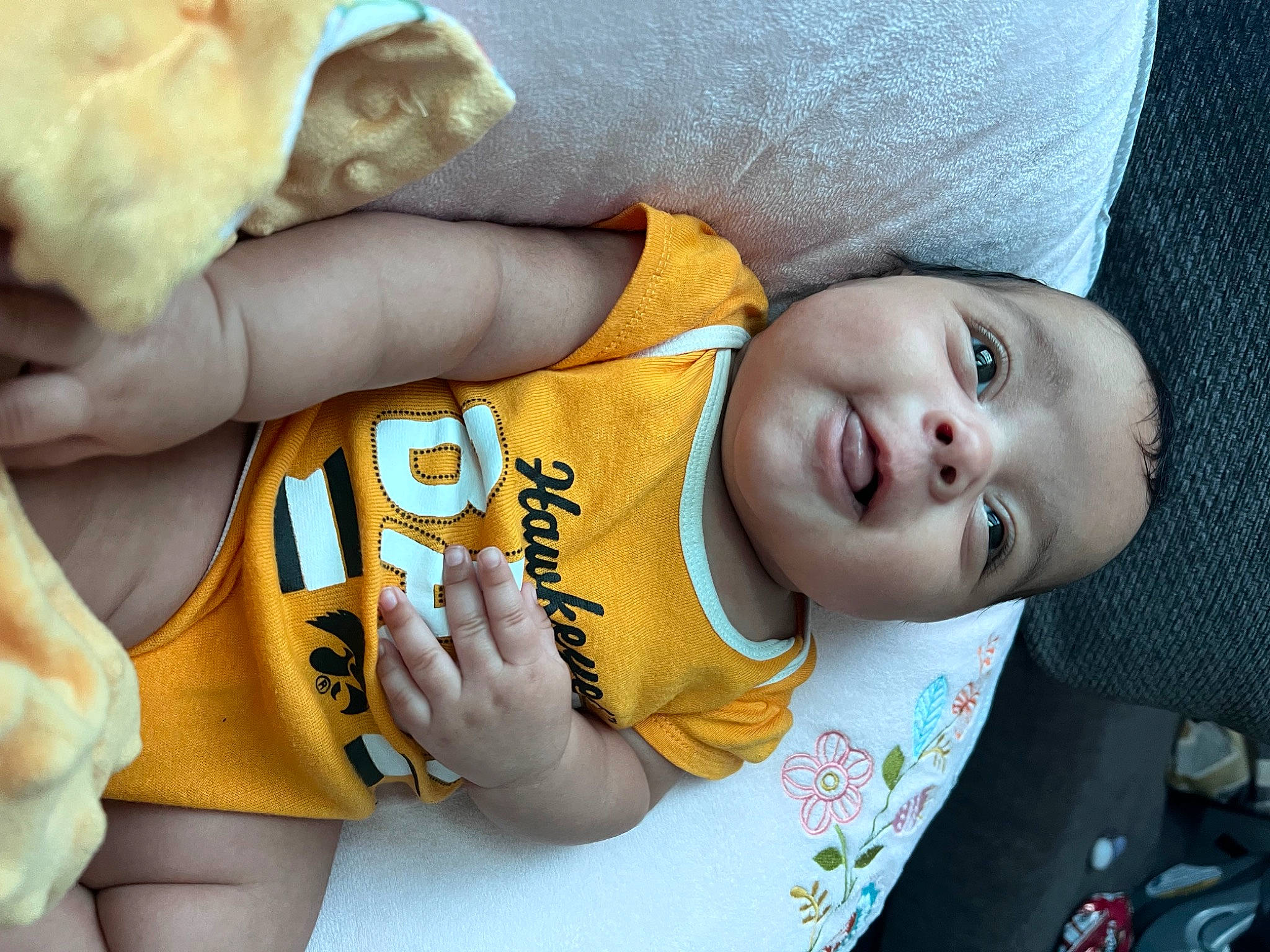 Millie is registered to the contest to win money with this photo: baby, baby_toddler_clothing, cheek, chin, cool, eye, facial_expression, hairstyle, happy, head, human_body, mammal, mouth, nose, organ, person, skin, sleeve, smile, toddler