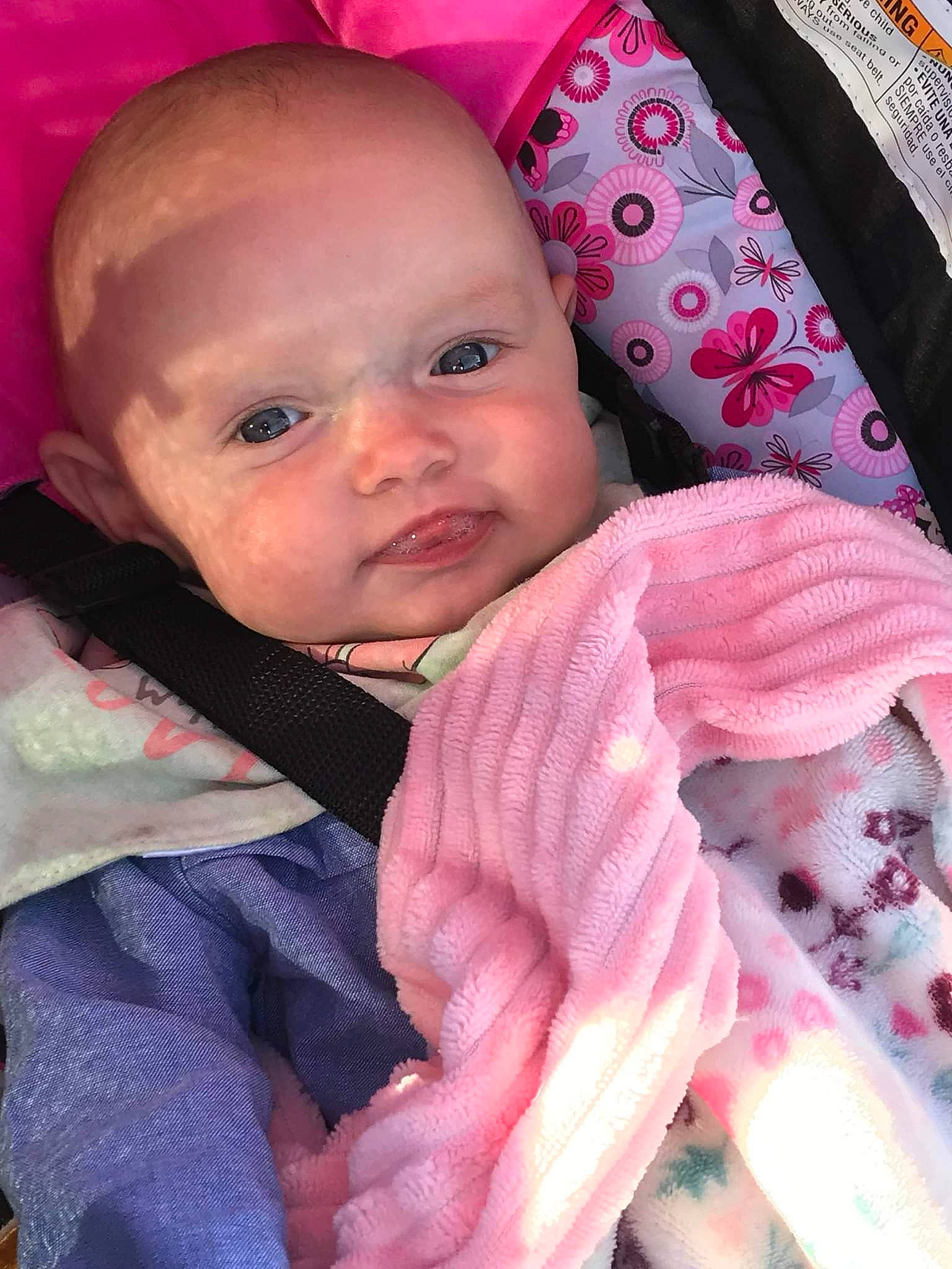 Bethany Lynn is registered to the contest to win money with this photo: baby, baby_products, baby_toddler_clothing, carmine, cheek, child, comfort, eyebrow, happy, iris, linens, lip, magenta, pattern, person, pink, room, skin, sleeve, textile