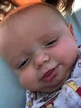 Boston is registered to the contest to win money with this photo: baby, cheek, ear, eyelash, forehead, gesture, hair, happy, human_body, iris, jaw, lip, mouth, neck, nose, person, skin, sleeve, smile, toddler