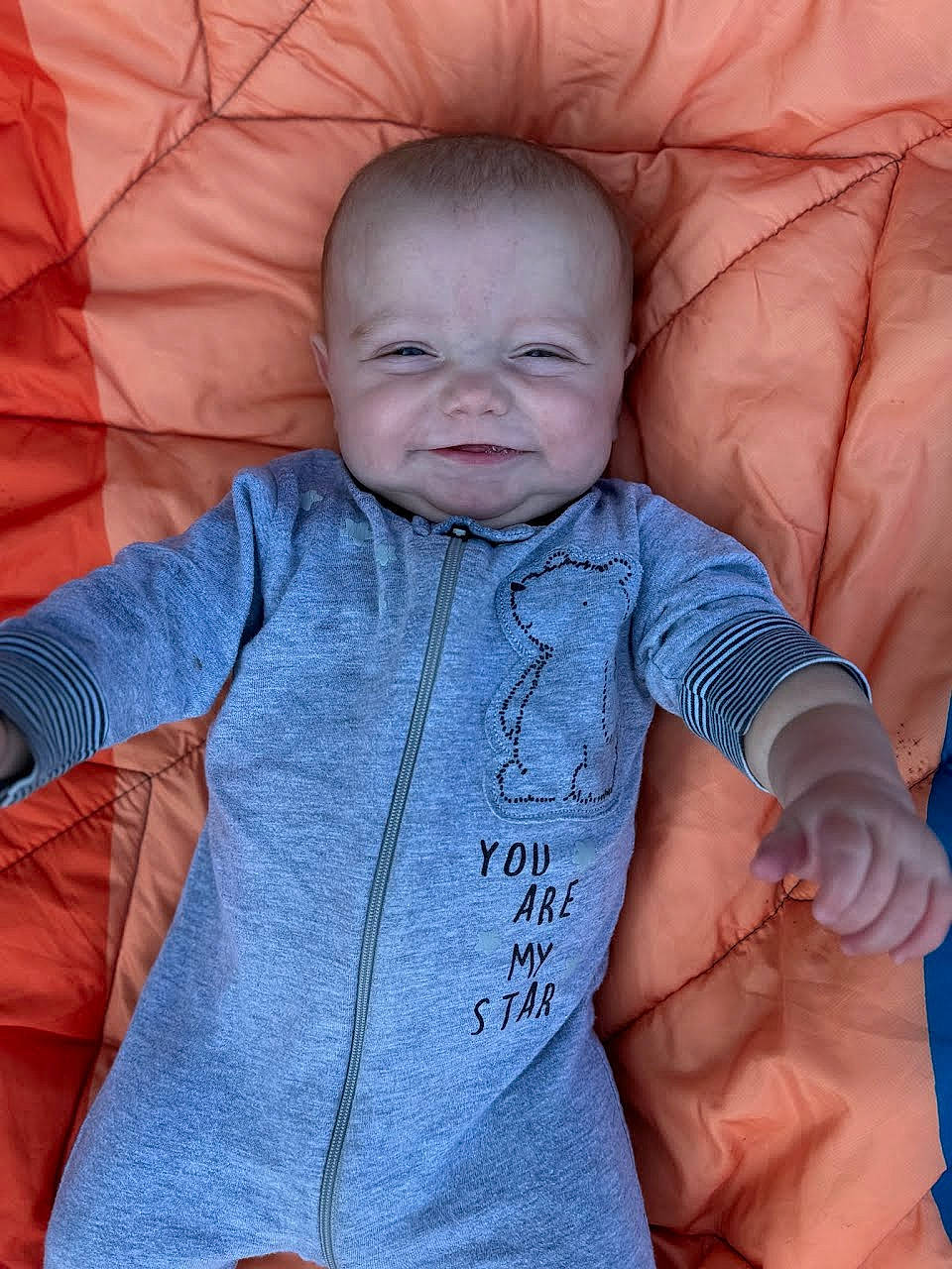 Boston joined the competition — help win amazing prizes! baby, baby_toddler_clothing, cheek, chin, comfort, facial_expression, gesture, head, human, lip, mouth, neck, nose, orange, outerwear, person, product, skin, sleeve, smile