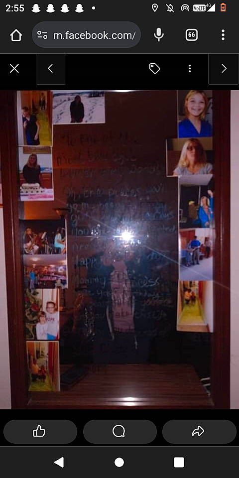 Bethany is registered to the contest to win money with this photo: advertising, blurred, communication_device, darkness, display_case, display_device, display_window, event, font, glass, joy, magenta, multimedia, person, portable_communications_device, reflection, retail, room, screenshot, sky