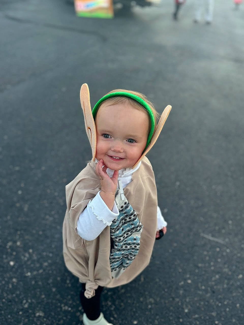 Bethany is registered to the contest to win money with this photo: asphalt, baby, baby_toddler_clothing, child, costume_hat, event, fashion_accessory, fun, gesture, grass, happy, headgear, holiday, joy, person, portrait_photography, recreation, road, road_surface, sleeve