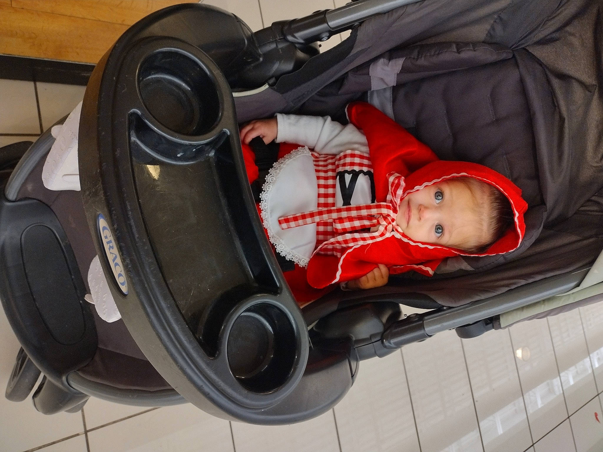 Emily is registered to the contest to win money with this photo: audio_equipment, auto_part, automotive_design, automotive_exterior, automotive_lighting, automotive_tire, automotive_wheel_system, baby, baby_carriage, car, fender, helmet, motor_vehicle, person, rim, tire, toddler, vehicle, vehicle_door, wheel