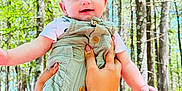 Aida joined the competition — help win amazing prizes! baby, child, person, forest, trees, nature, outdoor, green_overalls, smile, happy, hands, woman, background, sunlight, daylight, woodland, cute, holding, apparel, portrait