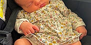 Mïa a rejoint le concours — aidez-le/la à gagner de superbes lots ! baby, sleeping, car_seat, floral_dress, infant, peaceful, child, toddler, foot, hand, soft_lighting, cute, indoors, seat_belt, closeup, portrait, newborn, skin, clothing, comfort