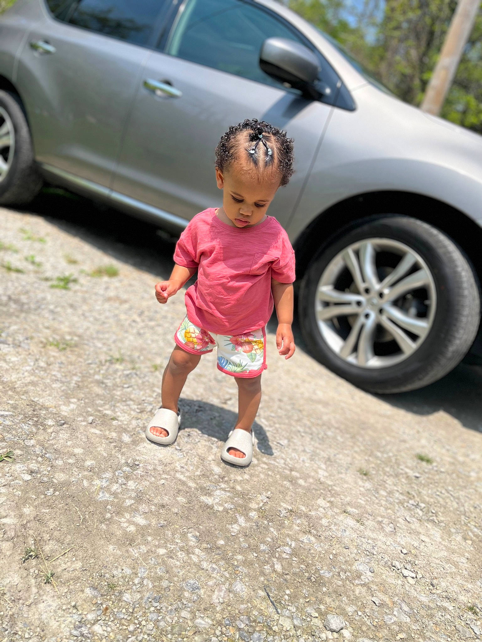 Kadasia is registered to the contest to win money with this photo: alloy_wheel, asphalt, automotive_design, automotive_exterior, automotive_lighting, automotive_tire, automotive_wheel_system, bumper, car, land_vehicle, motor_vehicle, person, plant, rim, road, shorts, tints_and_shades, tire, vehicle, vehicle_door