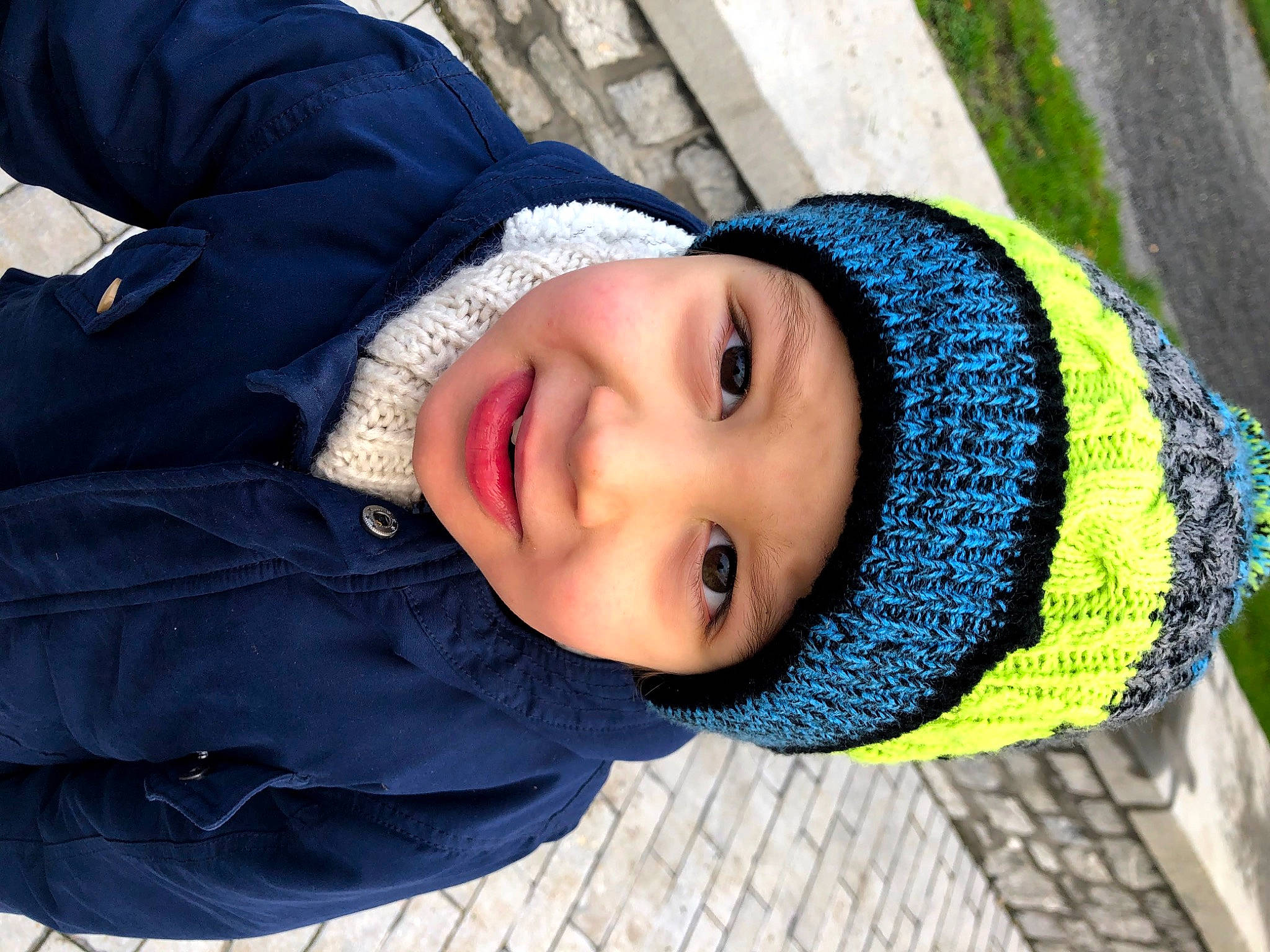 Theo a rejoint le concours — aidez-le/la à gagner de superbes lots ! cap, cheek, child, cool, electric_blue, facial_expression, fun, happy, headgear, headwear, jacket, joy, leisure, mammal, nose, outerwear, person, plant, smile, street_fashion