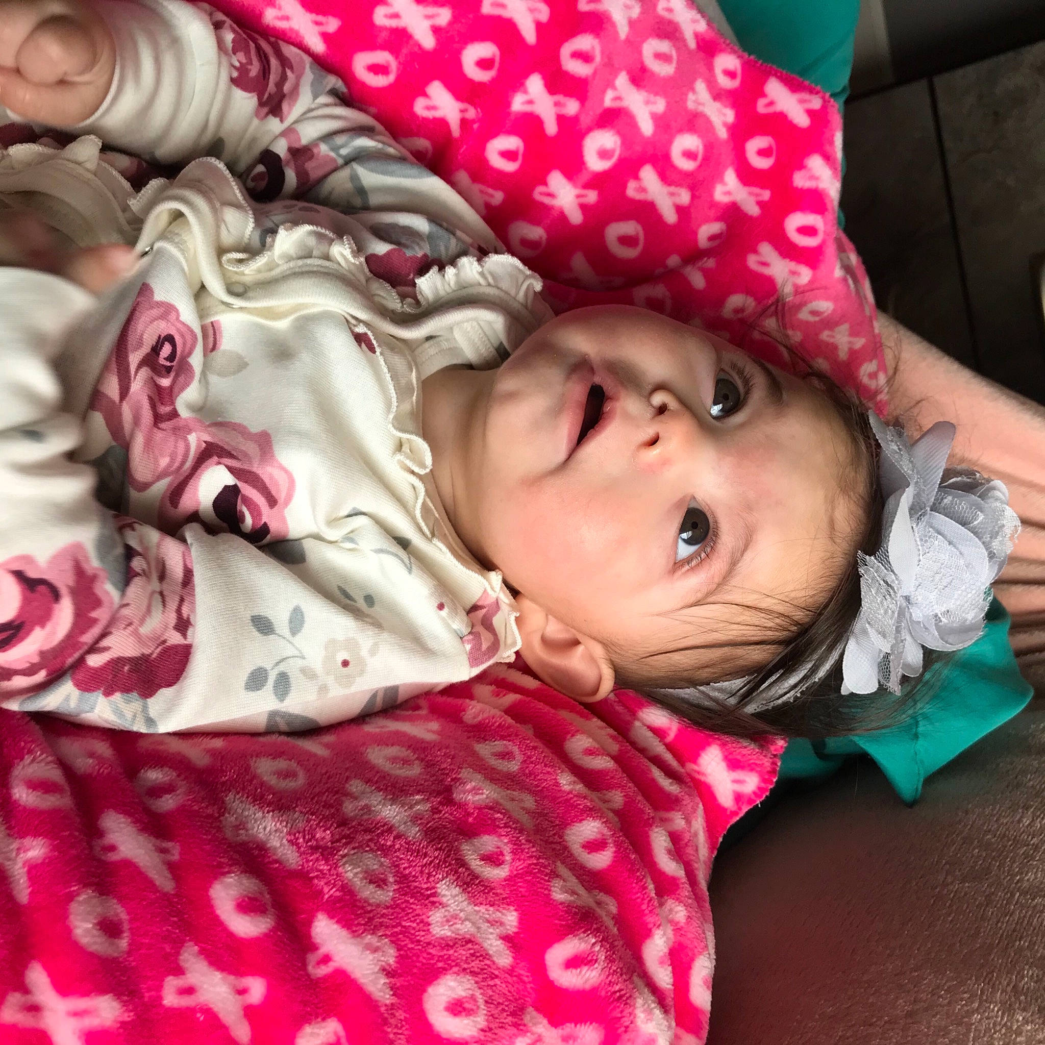 Anais is registered to the contest to win money with this photo: baby_toddler_clothing, cheek, comfort, cool, eye, eyelash, face, fashion, hairstyle, happy, headwear, linens, lip, magenta, mouth, pattern, person, pink, purple, red