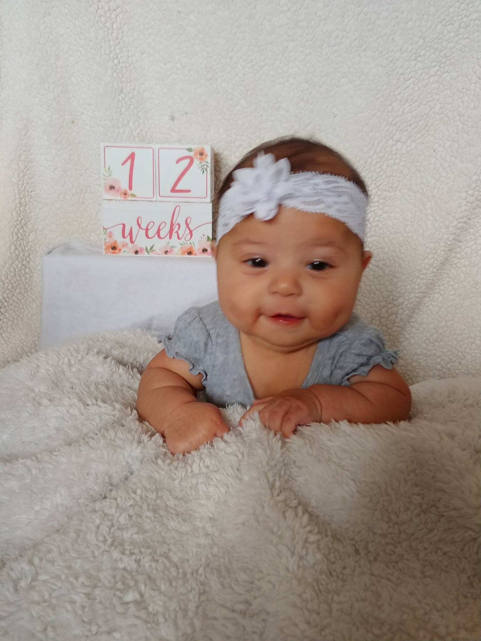 Leilani is registered to the contest to win money with this photo: baby, baby_products, baby_toddler_clothing, child, face, fashion_accessory, hair_accessory, head, headband, headgear, headpiece, person, product, room, skin, smile, toddler