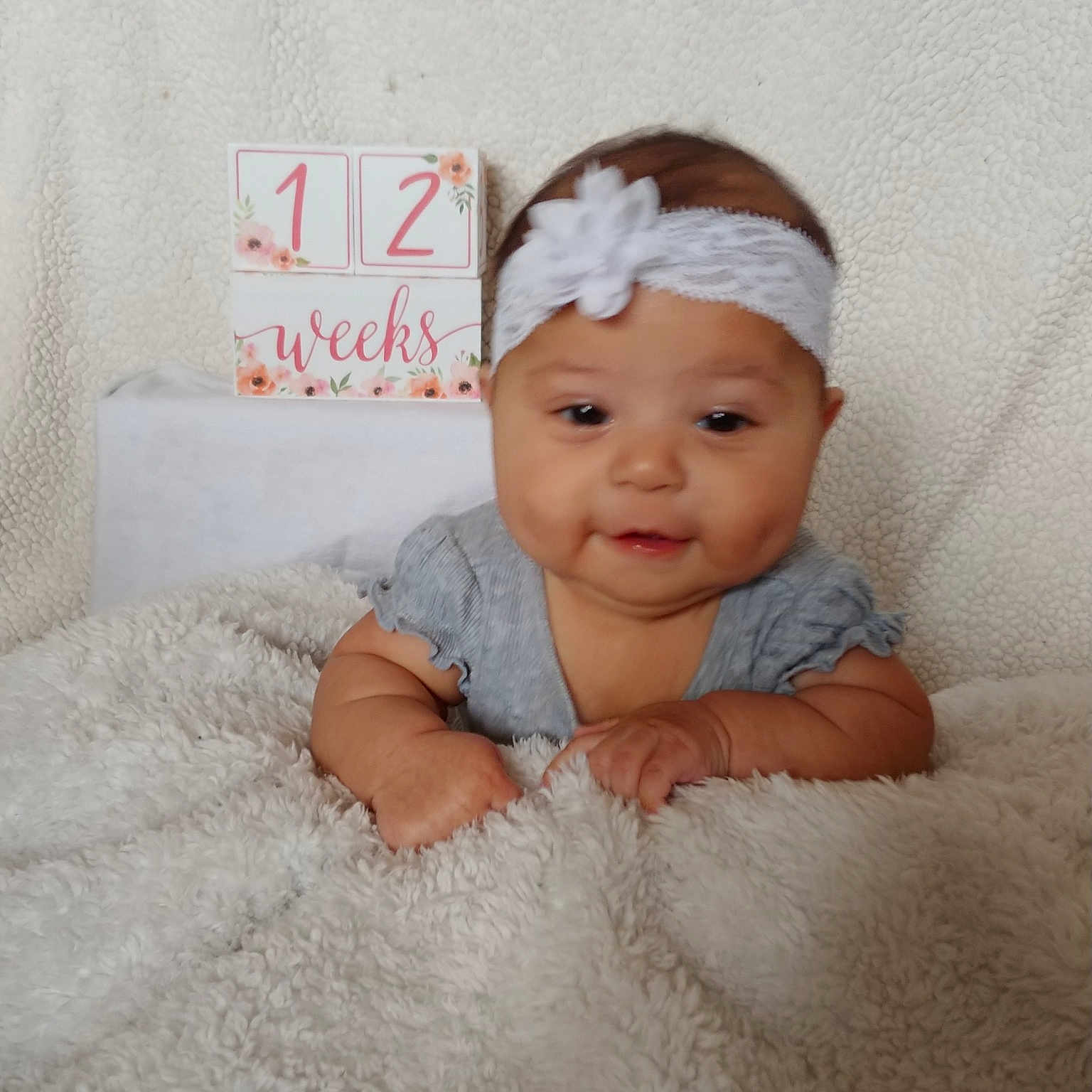 Leilani is registered to the contest to win money with this photo: baby, baby_products, baby_toddler_clothing, child, face, fashion_accessory, hair_accessory, head, headband, headgear, headpiece, person, product, room, skin, smile, toddler