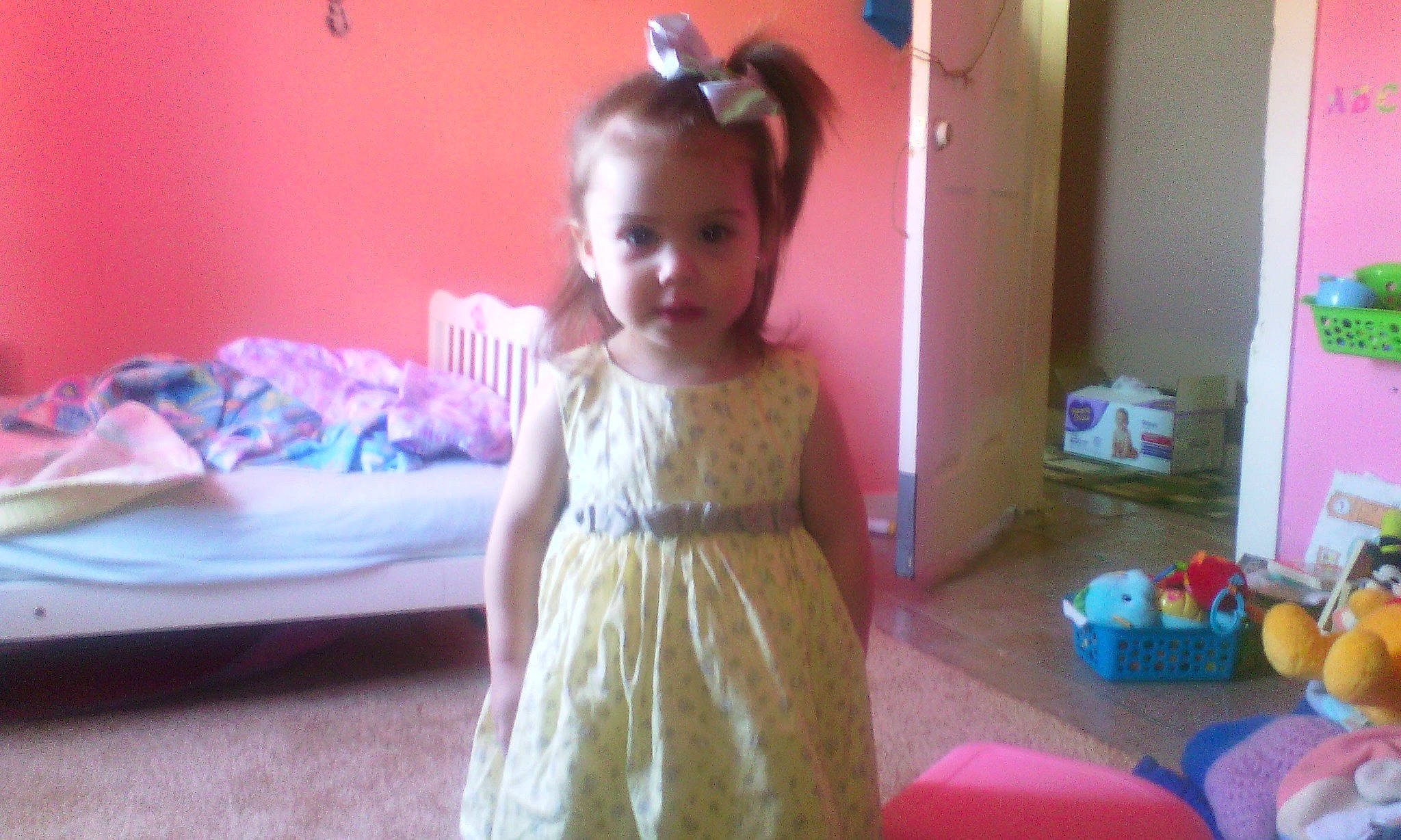 Amiah joined the competition — help win amazing prizes! cheek, child, dress, fun, hair, hair_accessory, hairstyle, long_hair, person, pink, play, room, smile, standing, toddler, toy