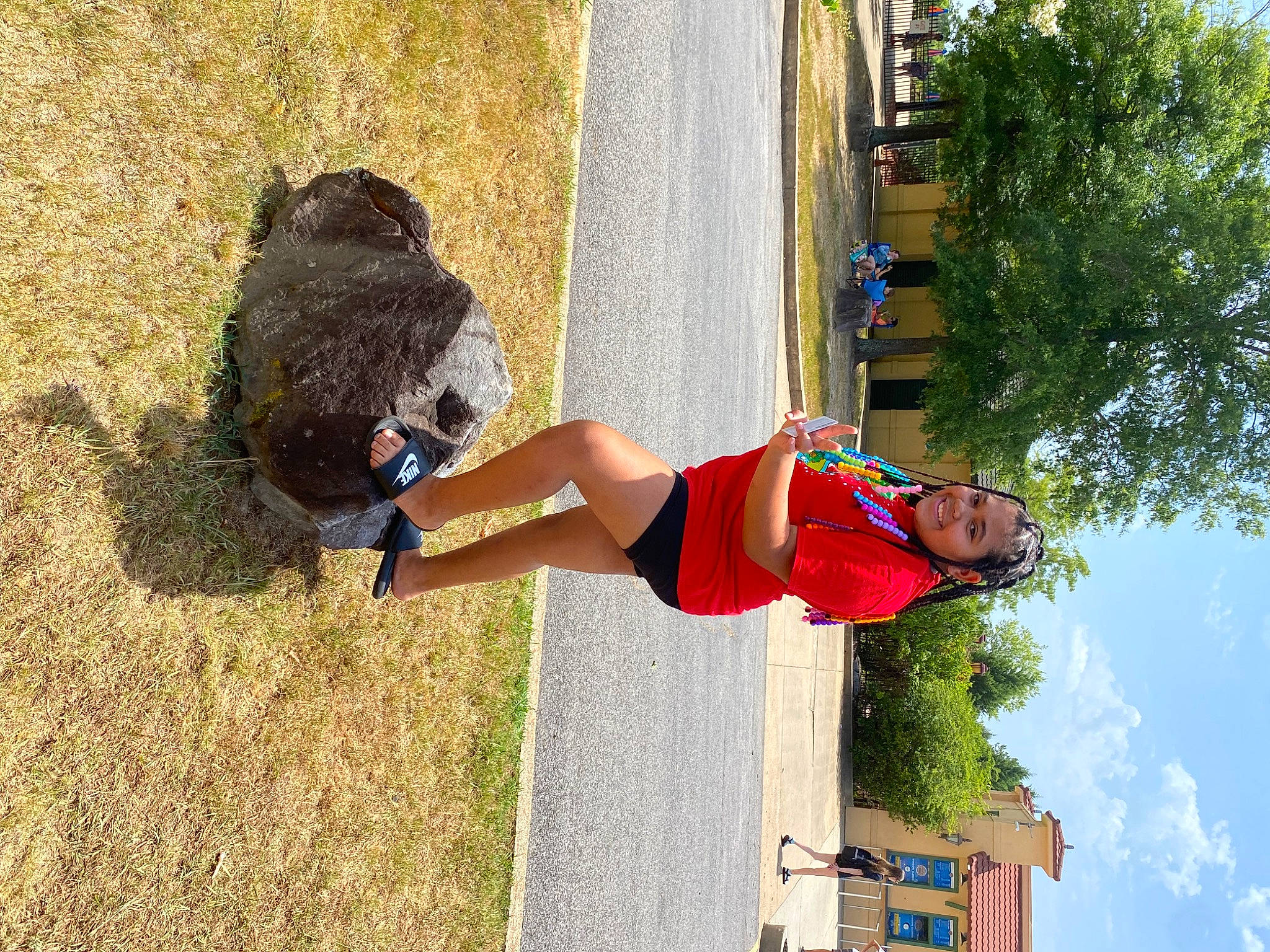 Amaziah is registered to the contest to win money with this photo: balance, elbow, fun, grass, happy, human_leg, joy, knee, leisure, people_in_nature, person, physical_fitness, recreation, shorts, sky, soil, thigh, tree