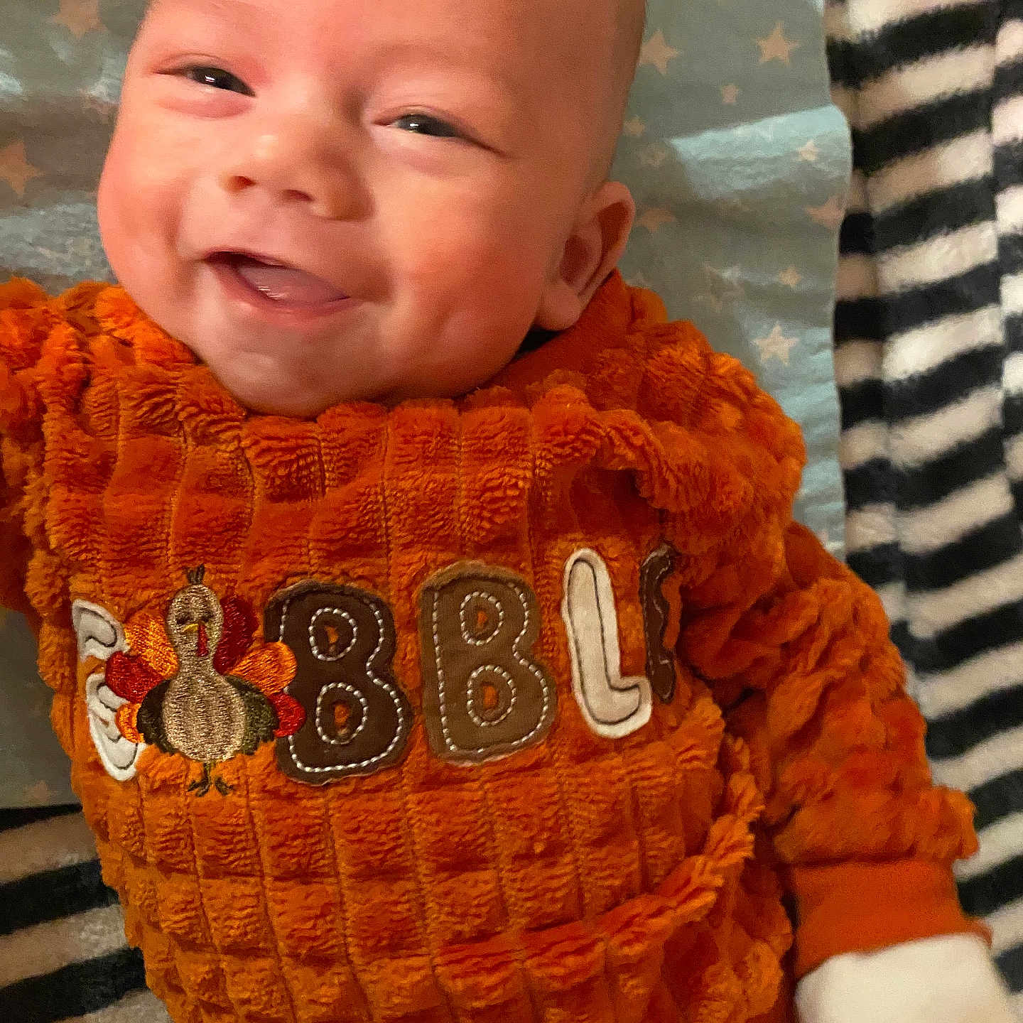 Ashten joined the competition — help win amazing prizes! animal, baby, babylaughing, bird, clothing, coat, face, glove, happy, head, jacket, knitwear, laughing, newborn, person, photography, portrait, smile, sweater, t_shirt