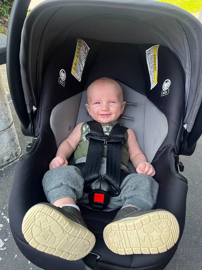 Mason is registered to the contest to win money with this photo: auto_part, automotive_design, baby_carriage, baby_in_car_seat, baby_products, baby_toddler_clothing, car_seat, car_seat_cover, child, comfort, face, head_restraint, joy, lap, motor_vehicle, person, seat_belt, sitting, smile, toddler