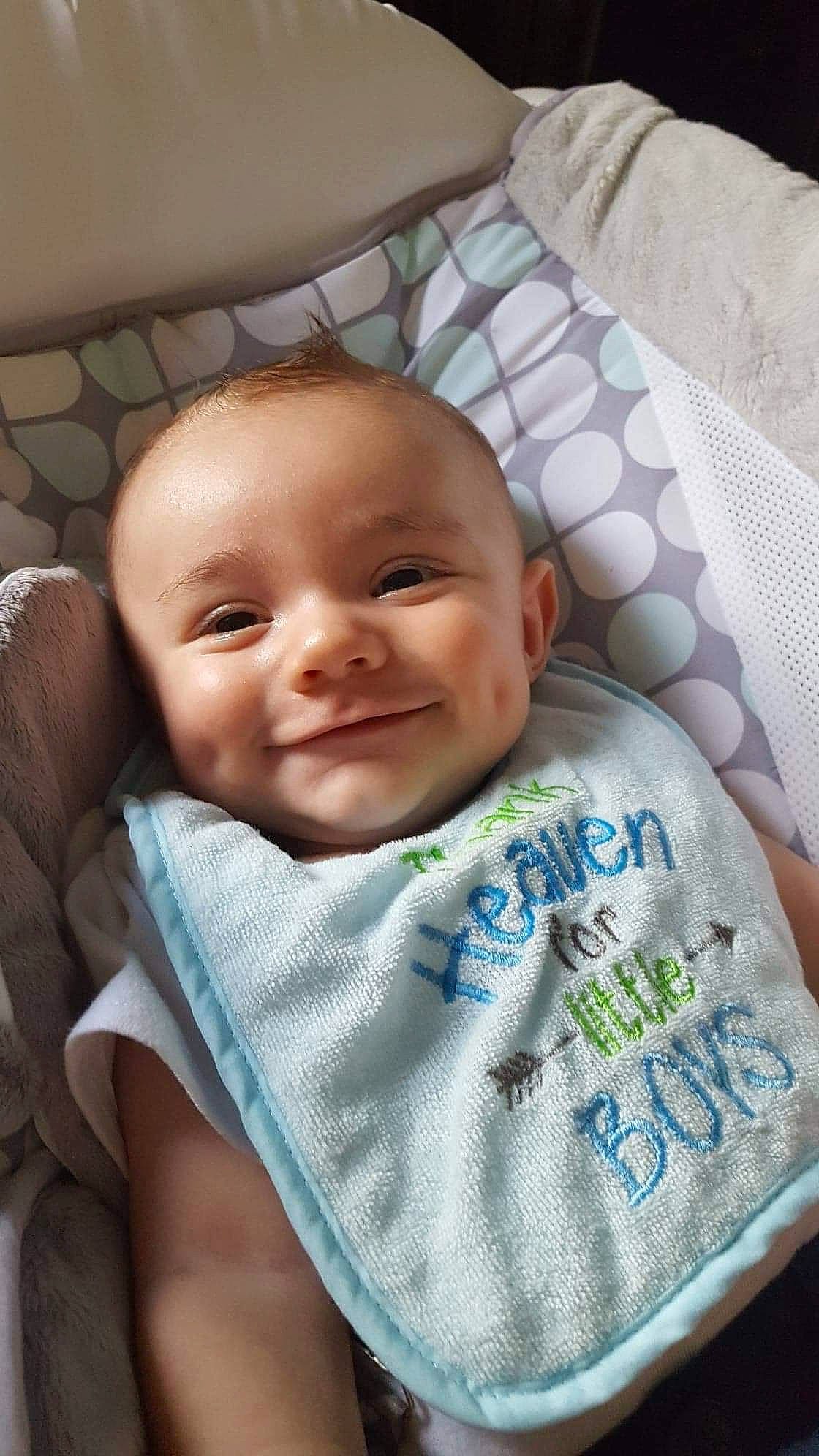 Rowan is registered to the contest to win money with this photo: baby, baby_products, baby_safety, baby_toddler_clothing, bib, cheek, child, comfort, eye, home_accessories, joy, linens, person, textile, toddler