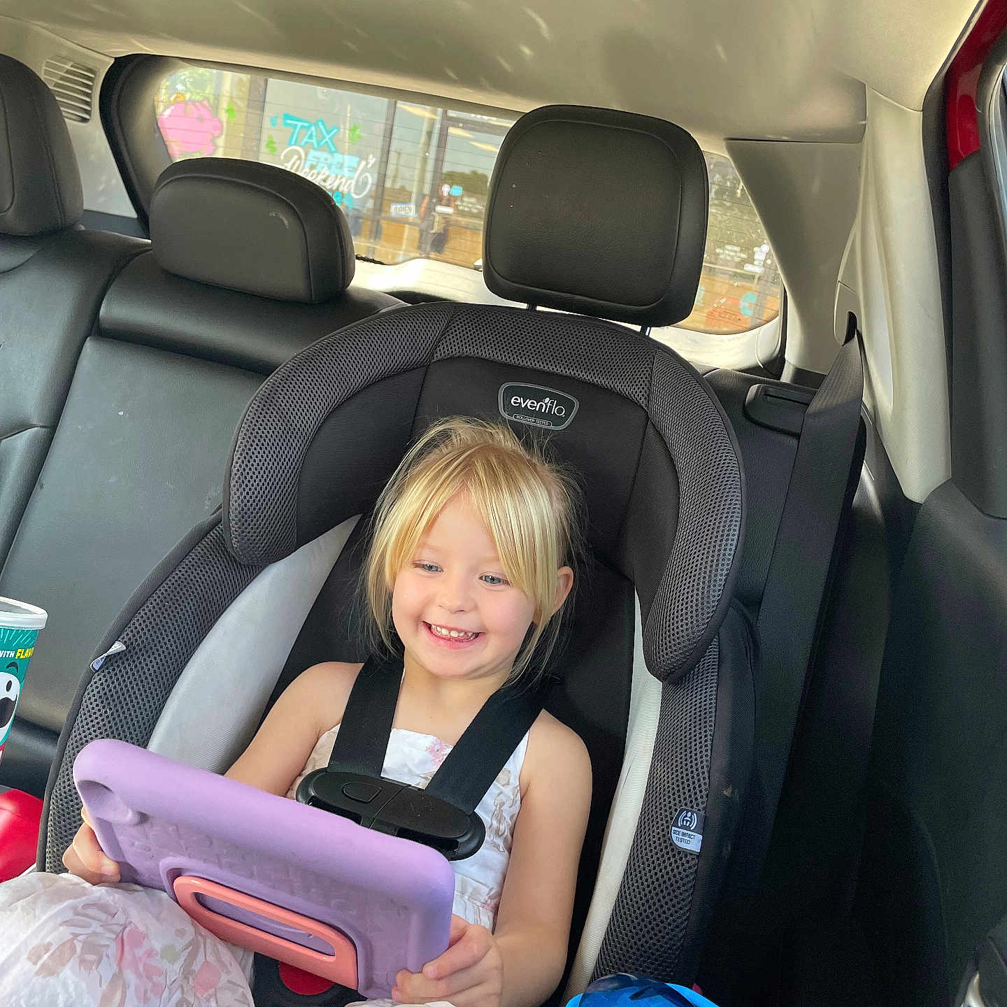 Madison is registered to the contest to win money with this photo: car, car_interior, carseat, chair, child, computer, cushion, electronics, face, female, furniture, girl, head, headrest, homedecor, person, photography, portrait, transportation, vehicle