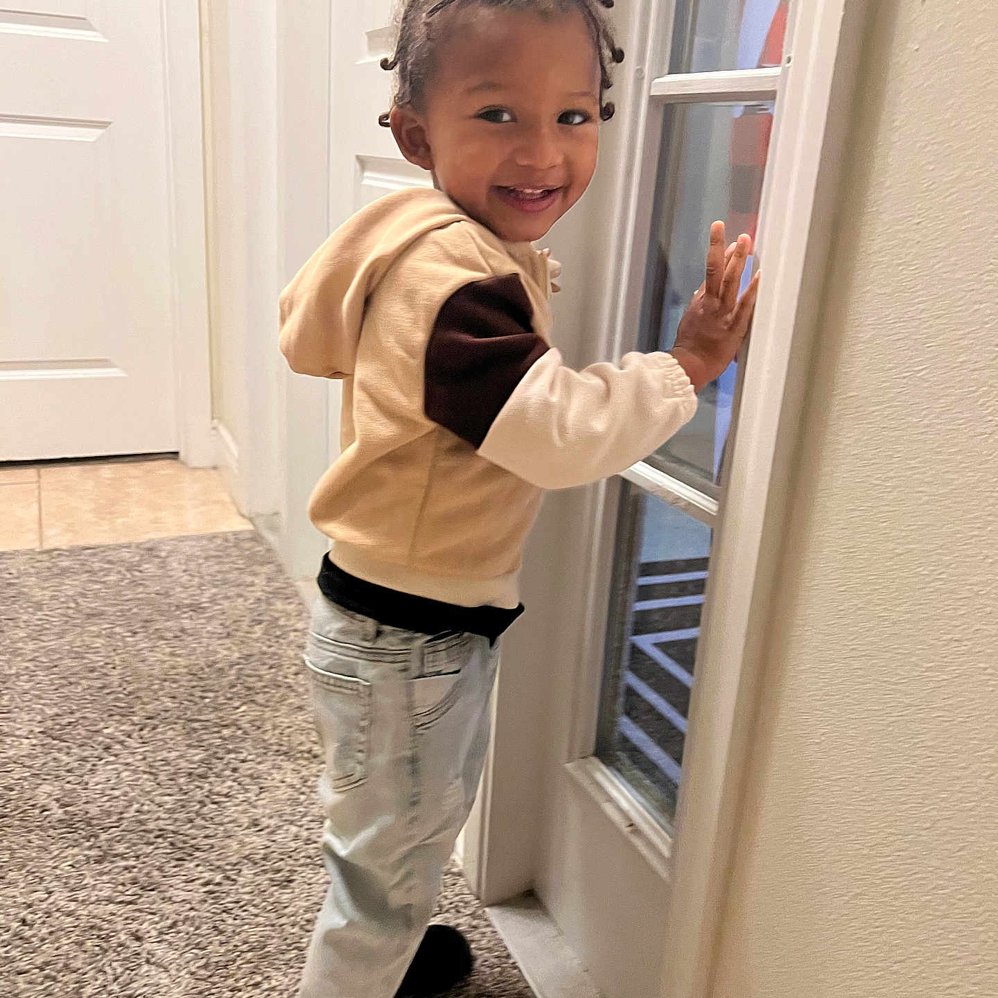 Dior joined the competition — help win amazing prizes! black_shoes, braided_hair, carpet, casual_clothing, child, door, floor, glass_door, happy, home_interior, hoodie, indoors, jeans, light_skin, portrait, smiling, standing, toddler, wall, young_child
