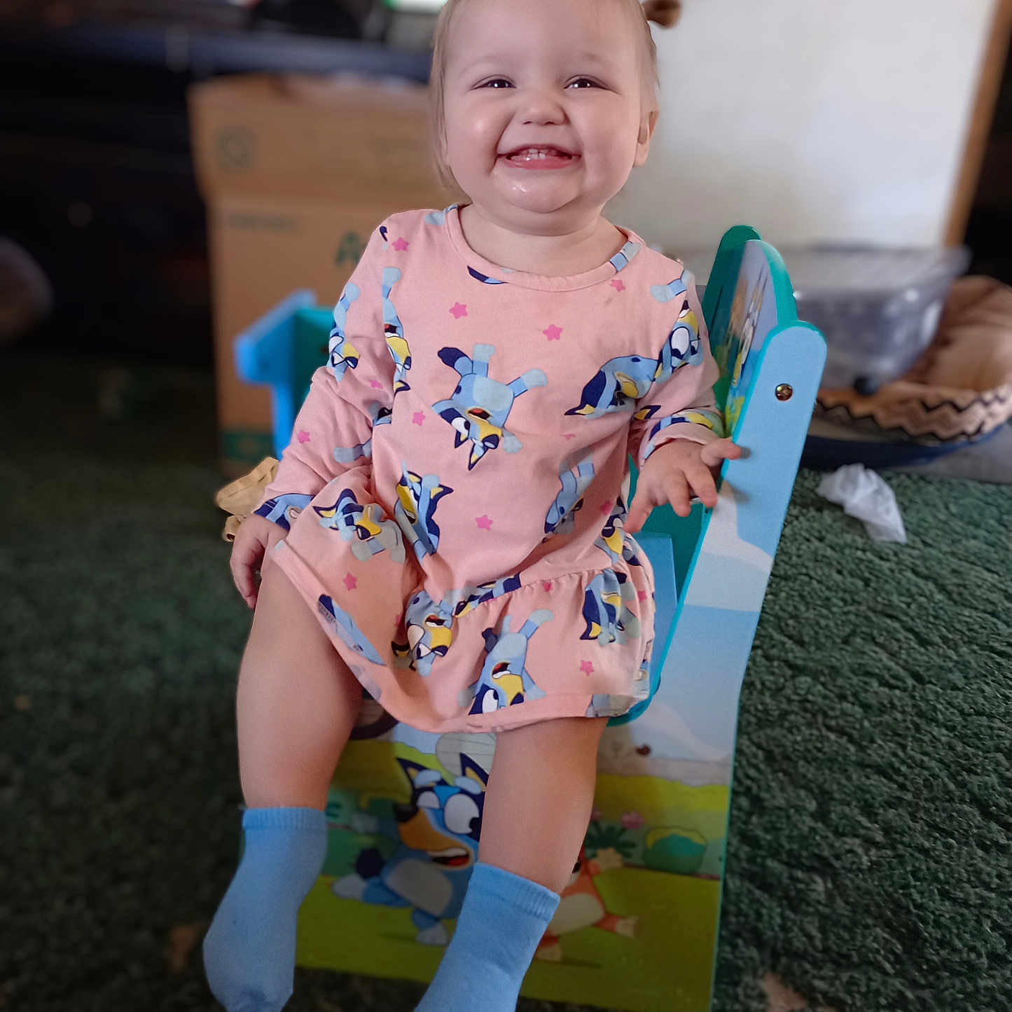 Nevaeh is registered to the contest to win money with this photo: baby, bathroom, chair, clothing, dress, face, furniture, happy, head, hosiery, indoors, person, photography, portrait, potty, room, sitting, smile, sock, toilet
