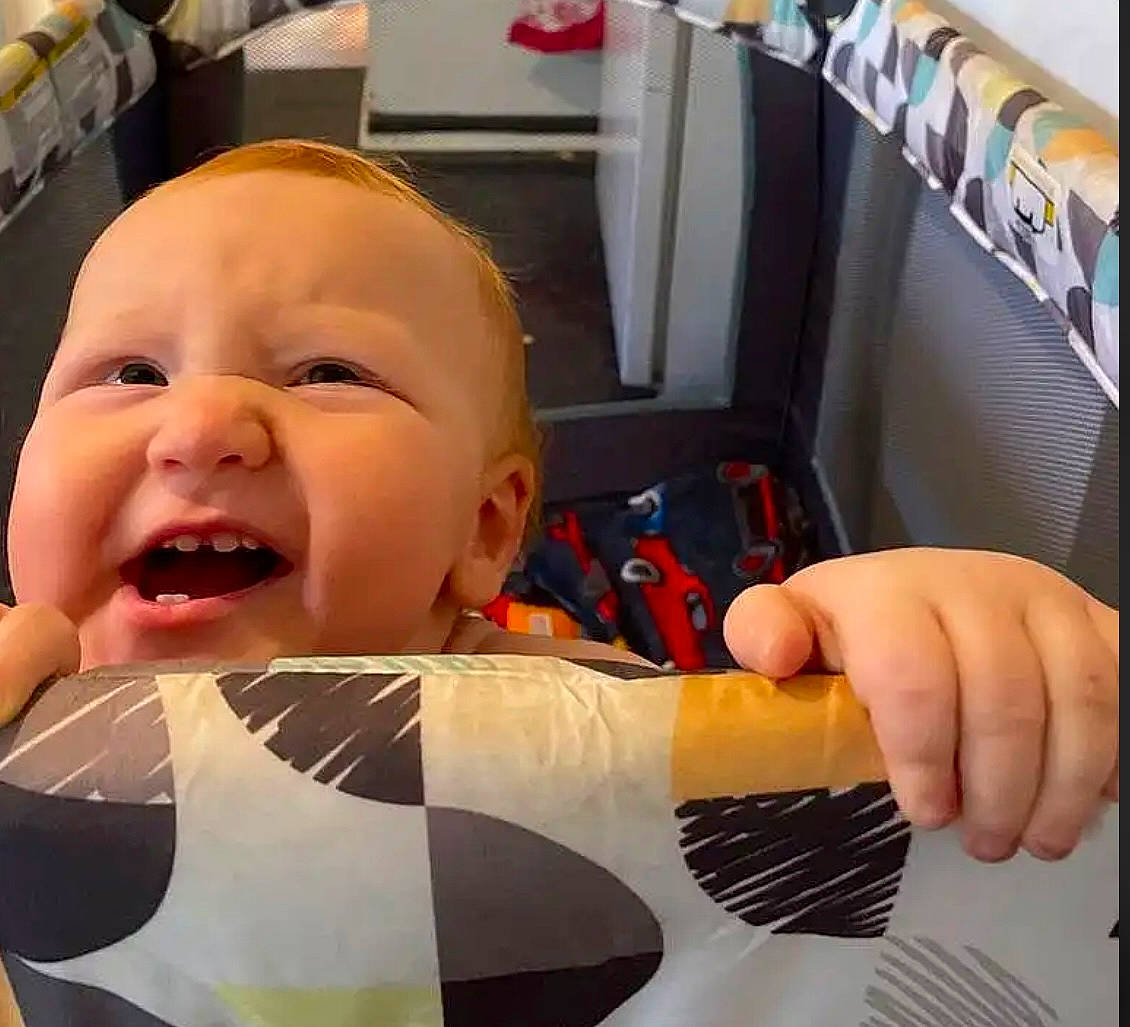 Joseph is registered to the contest to win money with this photo: arm, baby, baby_laughing, baby_products, child, comfort, eye, finger, gesture, hand, happy, head, human_body, mouth, person, personal_protective_equipment, smile, t_shirt, thumb, toddler