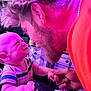 Daxx is registered to the contest to win money with this photo: baby, adult, face, hand, smile, interaction, indoor, person, curly_hair, striped_shirt, holding_hands, necklace, joy, closeup, purple_light, emotional, bond, love, affection, expression