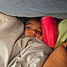 Michael joined the competition — help win amazing prizes! child, toddler, face, eyes, bed, blanket, pillow, bedding, cozy, indoors, portrait, peeking, lying_down, sleeping, red_bottle, green_blanket, soft_lighting, home, candid, closeup