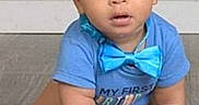 Michael joined the competition — help win amazing prizes! baby, blue_shirt, bow_tie, carpet, child, clothing, crawling, curious, curly_hair, eyes, face, floor, hands, indoor, photography, portrait, seated, smiling, toddler, wall