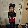 Michael joined the competition — help win amazing prizes! child, toddler, smiling, portrait, indoor, front_door, door, mickey_mouse, costume, black_shirt, red_shorts, curly_hair, standing, happy, home, entryway, welcome_mat, shoes, keys, light_switch