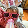 Mialynn joined the competition — help win amazing prizes! baby, bottle, milk, sunglasses, bunny_ears, pink, person, indoors, hand, clothing, cute, child, feeding, soft, blanket, home, infant, wearing, headwear, cozy