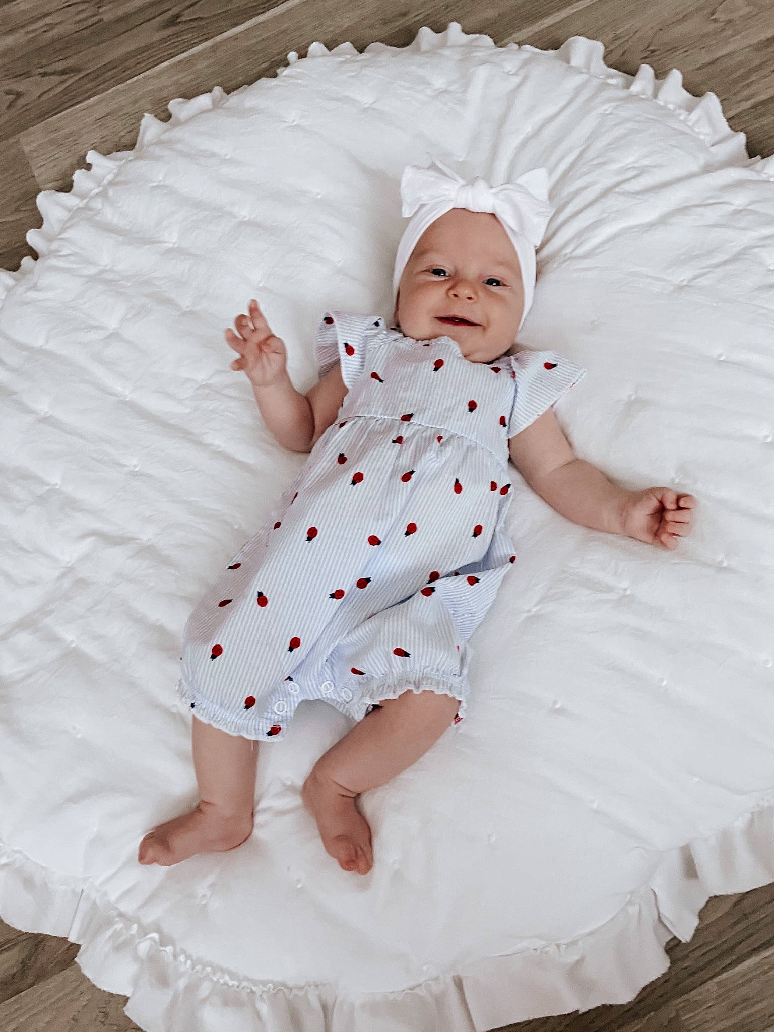 Adelaide is registered to the contest to win money with this photo: baby, baby_toddler_clothing, child, comfort, day_dress, dress, facial_expression, finger, hand, happy, headwear, linens, one_piece_garment, pattern, person, pink, product, skin, sleeve, textile