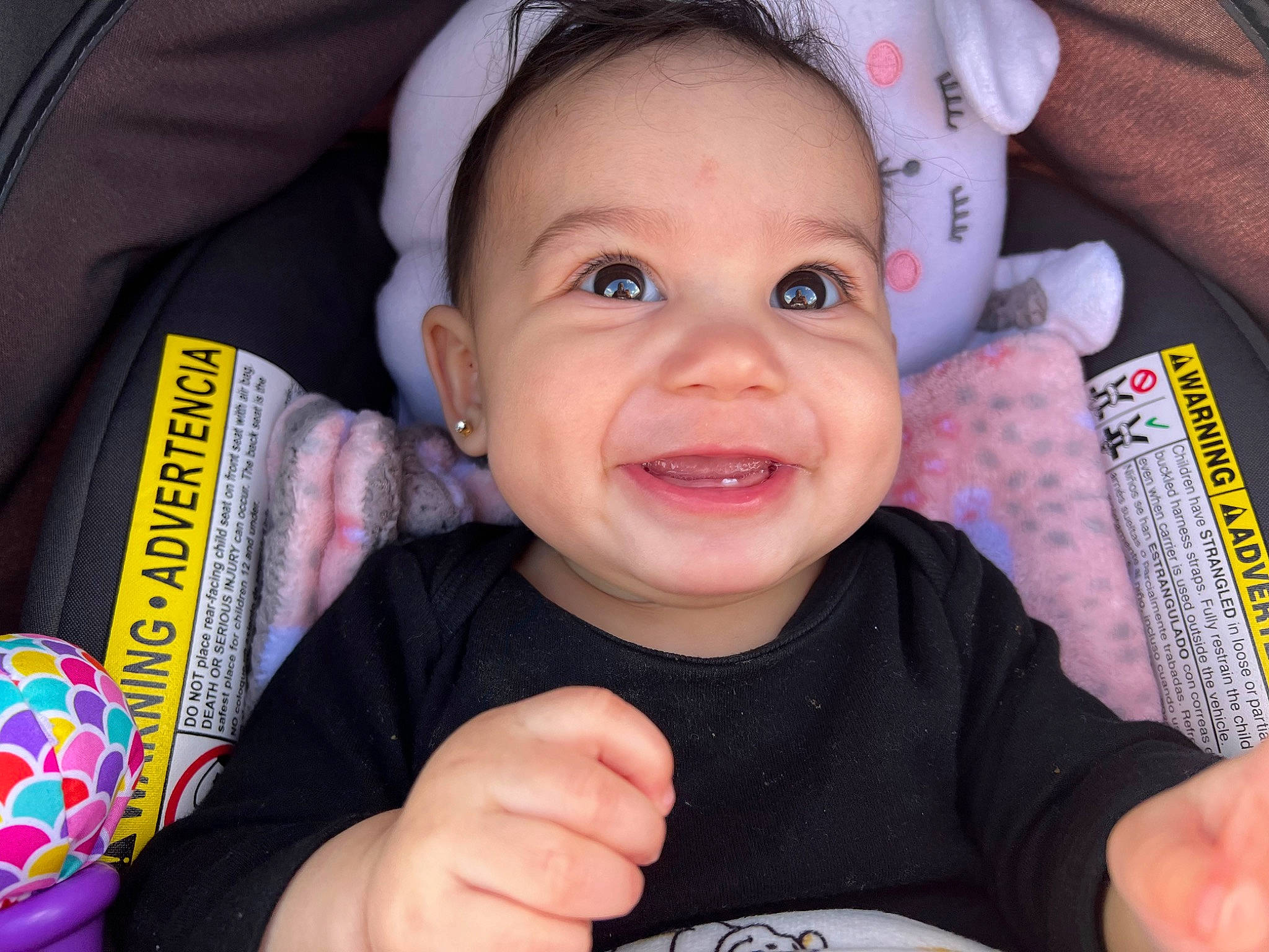 Maya is registered to the contest to win money with this photo: baby, baby_toddler_clothing, cheek, child, chin, eye, finger, gesture, happy, lip, mouth, nose, organ, person, product, skin, sleeve, smile, thumb, toddler