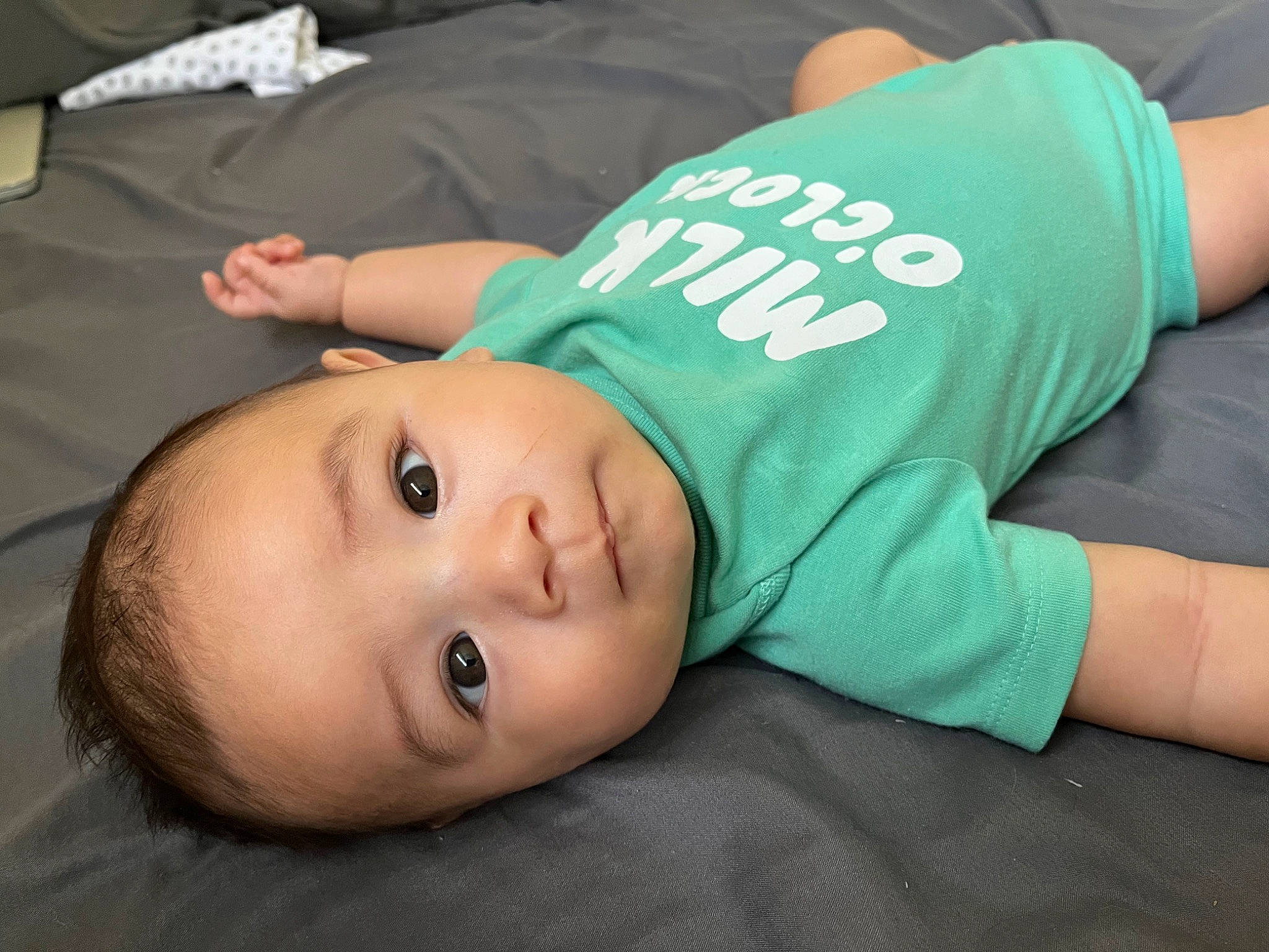 Cory is registered to the contest to win money with this photo: baby, cheek, child, comfort, elbow, eyelash, grass, hat, joint, knee, mouth, person, portrait_photography, sitting, sleeve, t_shirt, toddler