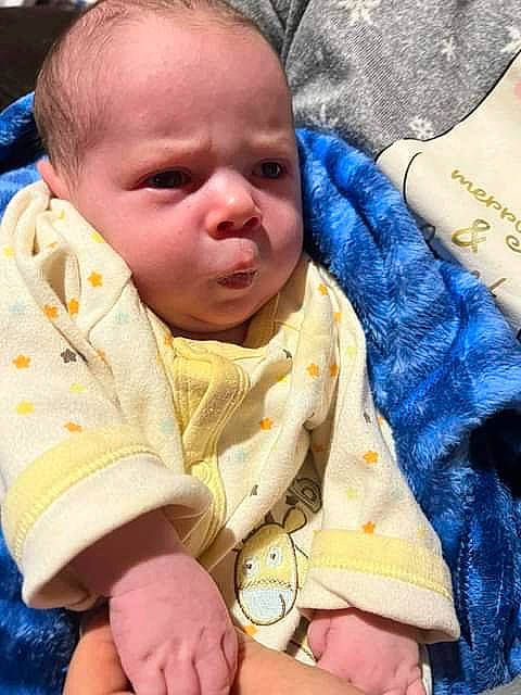 Johnny is registered to the contest to win money with this photo: baby, baby_products, baby_sleeping, baby_toddler_clothing, bedtime, cheek, child, comfort, finger, happy, linens, lip, mouth, nose, person, product, skin, sleeve, textile, thumb