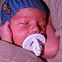 Walker joined the competition — help win amazing prizes! baby, sleeping, pacifier, blue_hat, blanket, cozy, infant, peaceful, closeup, face, newborn, cute, soft, knit, buttons, skin, child, resting, adorable, comfort